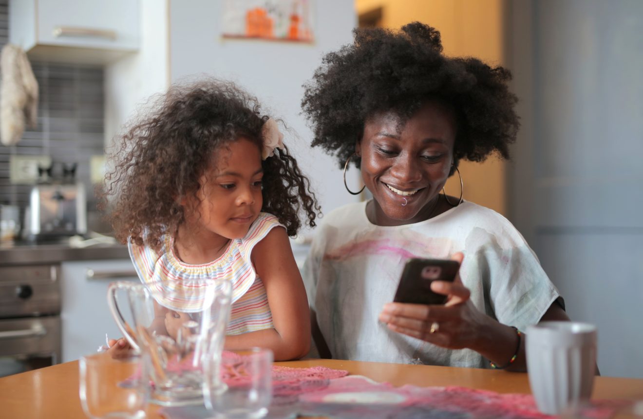 mother and daughter on a screen