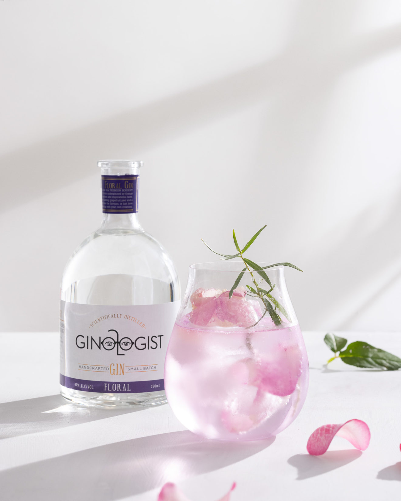 gin cocktail with rose petals and floral gin